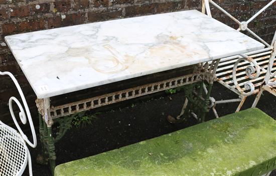 A Victorian cast iron based table with later white marble top